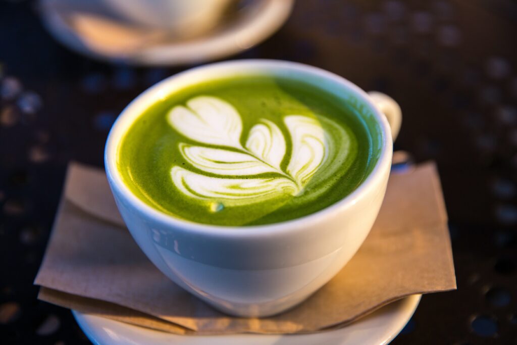 Green Tea Latte on a plate with a napkin