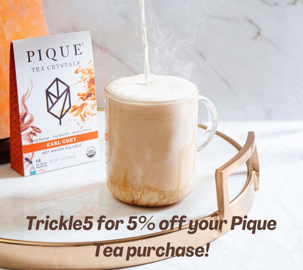 pique tea earl grey tea box sitting on counter with black tea latter and TRICKLE5 writing overlay for 5% discount