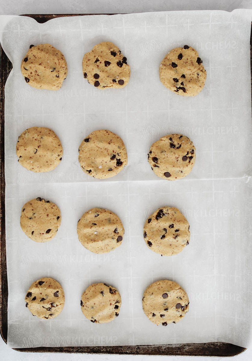 dairy free chocolate chip cookie dough on parchment paper lined baking sheet ready to go in oven