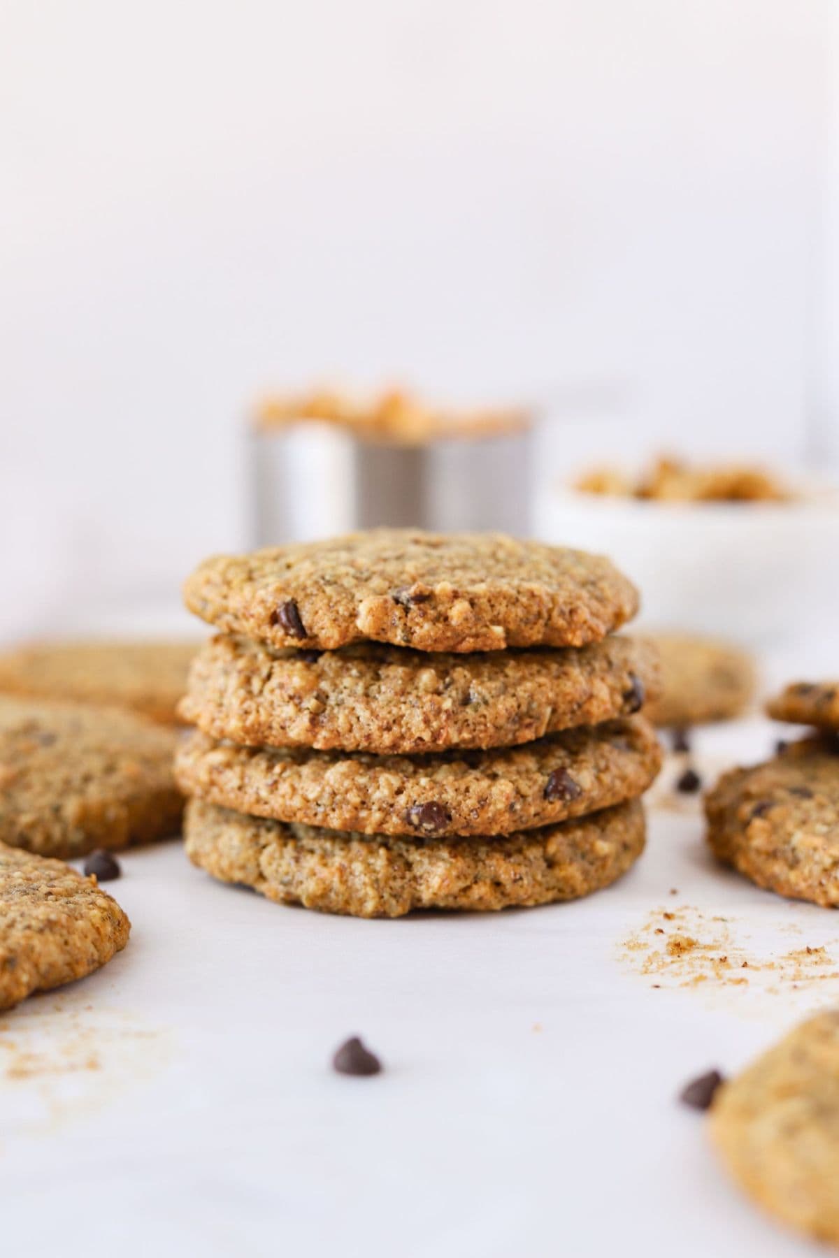 Stacked gluten and dairy free almond flour oatmeal breakfast cookies on counter.