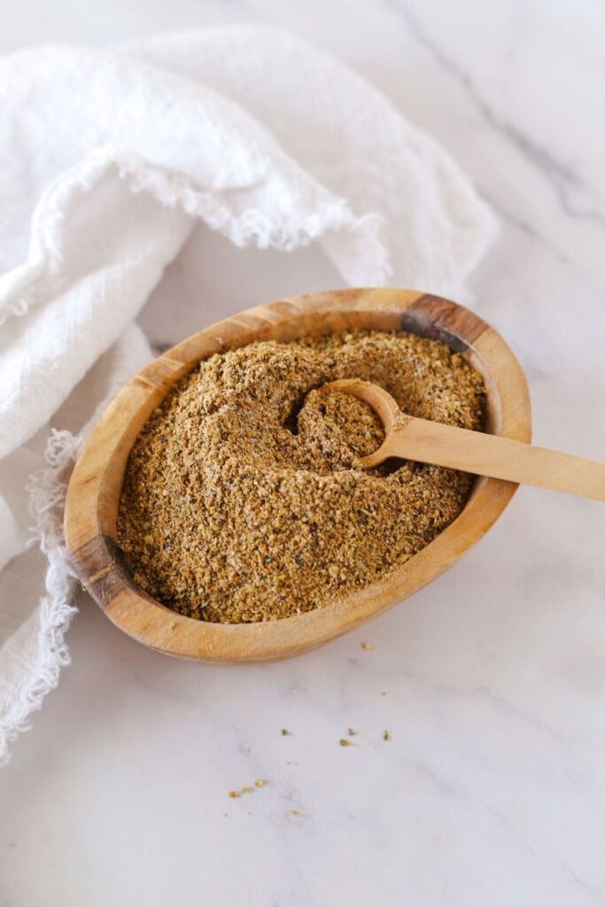 Nightshade free taco seasoning mixed in small wooden bowl.