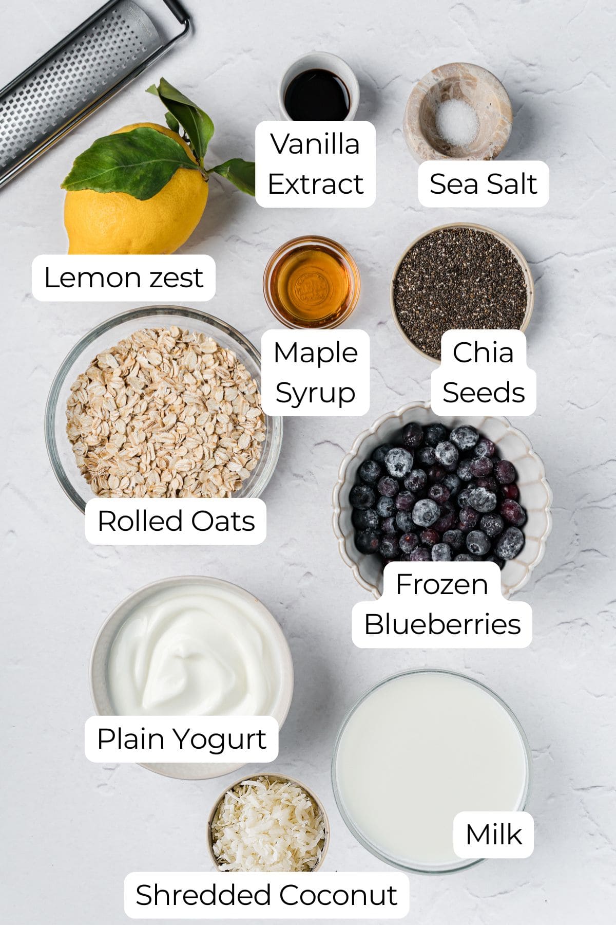 Labeled ingredients on a counter to make blueberry lemon overnight oats.