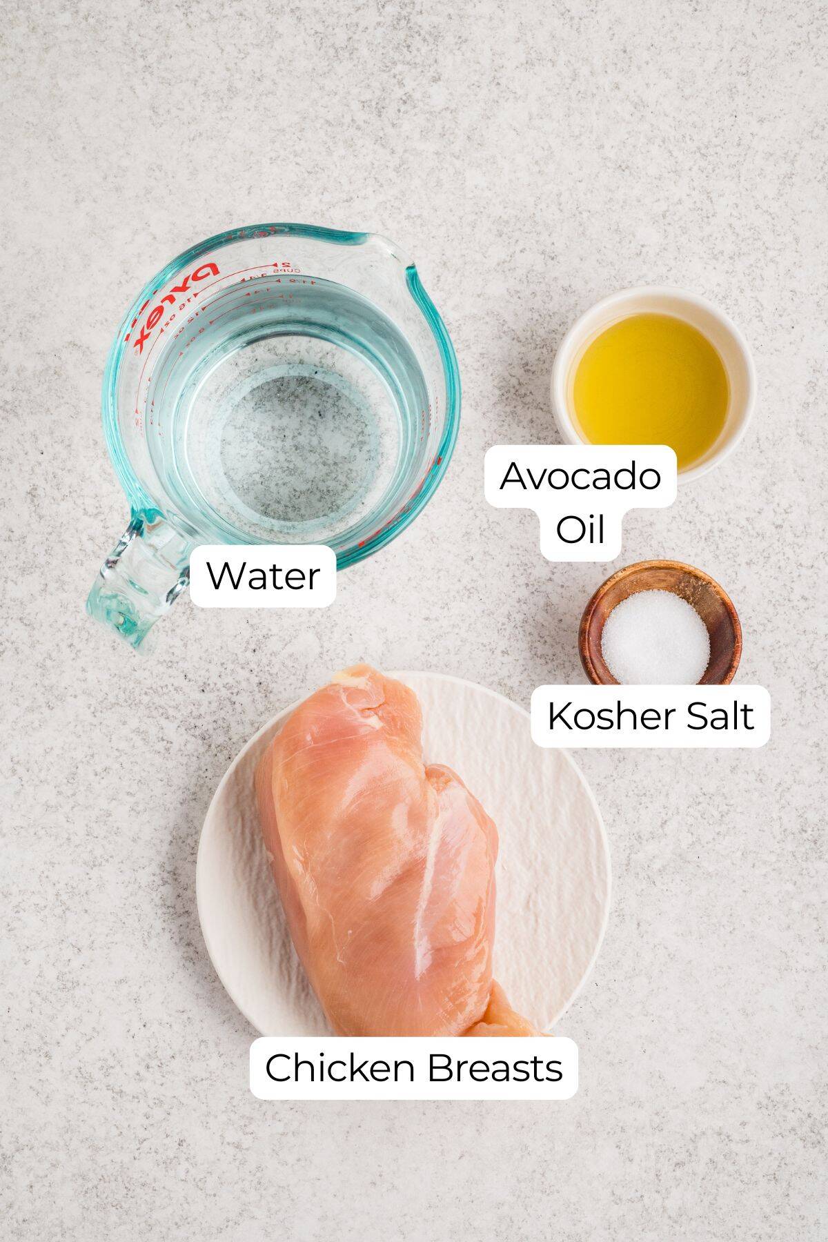 Labeled ingredients on a counter to make Dutch oven shredded chicken.