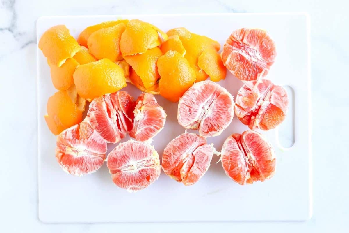 Peeled Cara Cara oranges on cutting board to be added to blender for dairy free orange chia pudding.